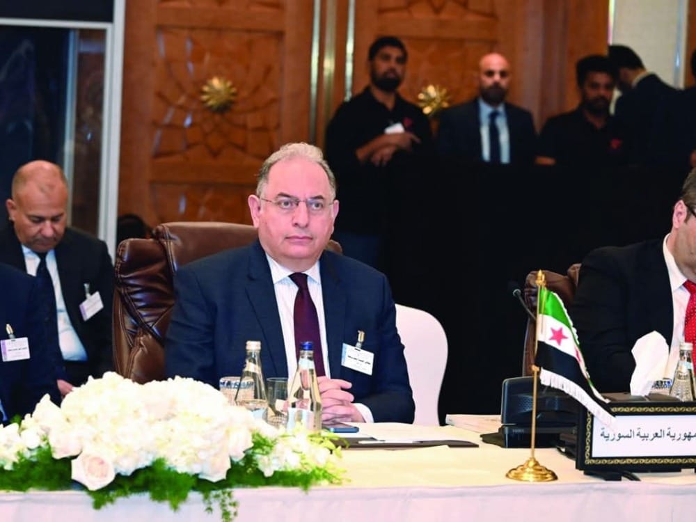 وزير المالية السوري خلال مؤتمر