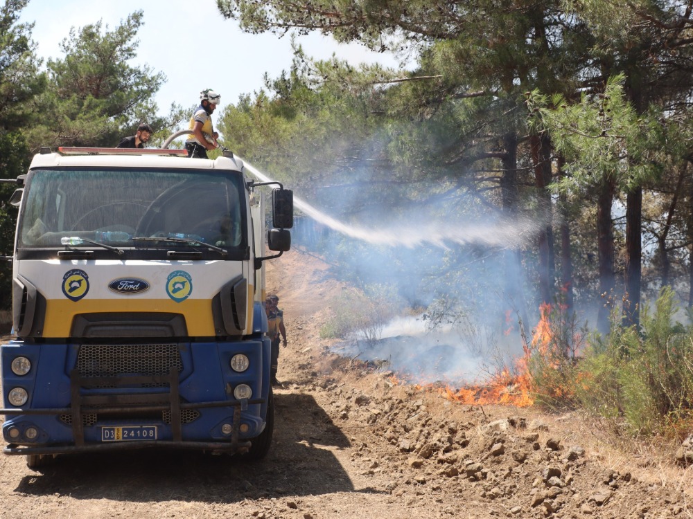 Civil Defense extinguishes a forest fire - Latakia, Syria